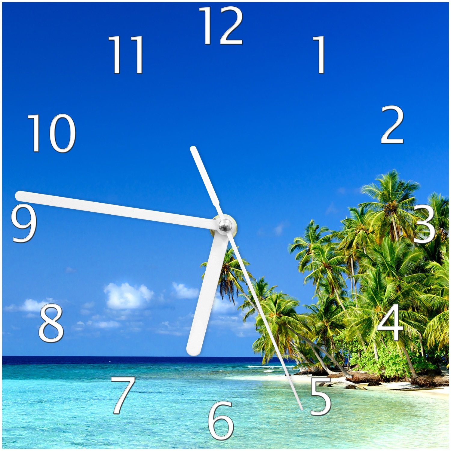 Wallario Uhr 30 x 60 cm, wei&szlig;e Zeiger Blauer Himmel  wei&szlig;er Strand  Palmen und das tiefblaue Meer 